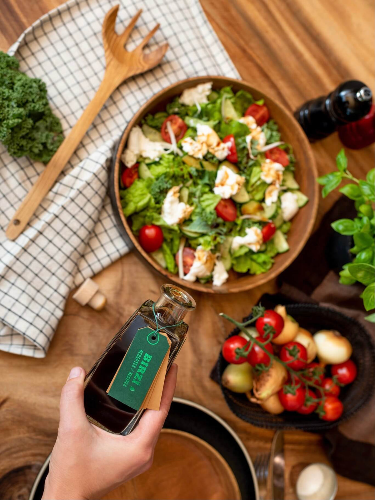 BIRZĪ apple syrup served over a fresh salad