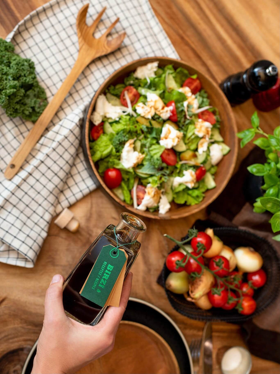 BIRZĪ apple syrup served over a fresh salad