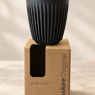 HuskeeOriginal 8oz Charcoal cup on original packaging